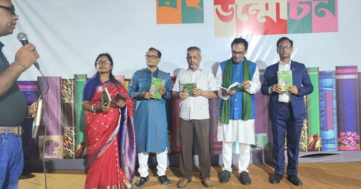Journalist Deepak Acharjee opens book cover of novel, “Sesh Mohonay” at Ekushe Book Fair Journalist Deepak Acharjee opens book cover of novel, “Sesh Mohonay” at Ekushe Book Fair