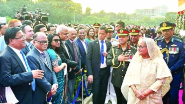 Prime Minister Sheikh Hasina exchanged pleasantries with guests at Senakunja yesterday marking the A